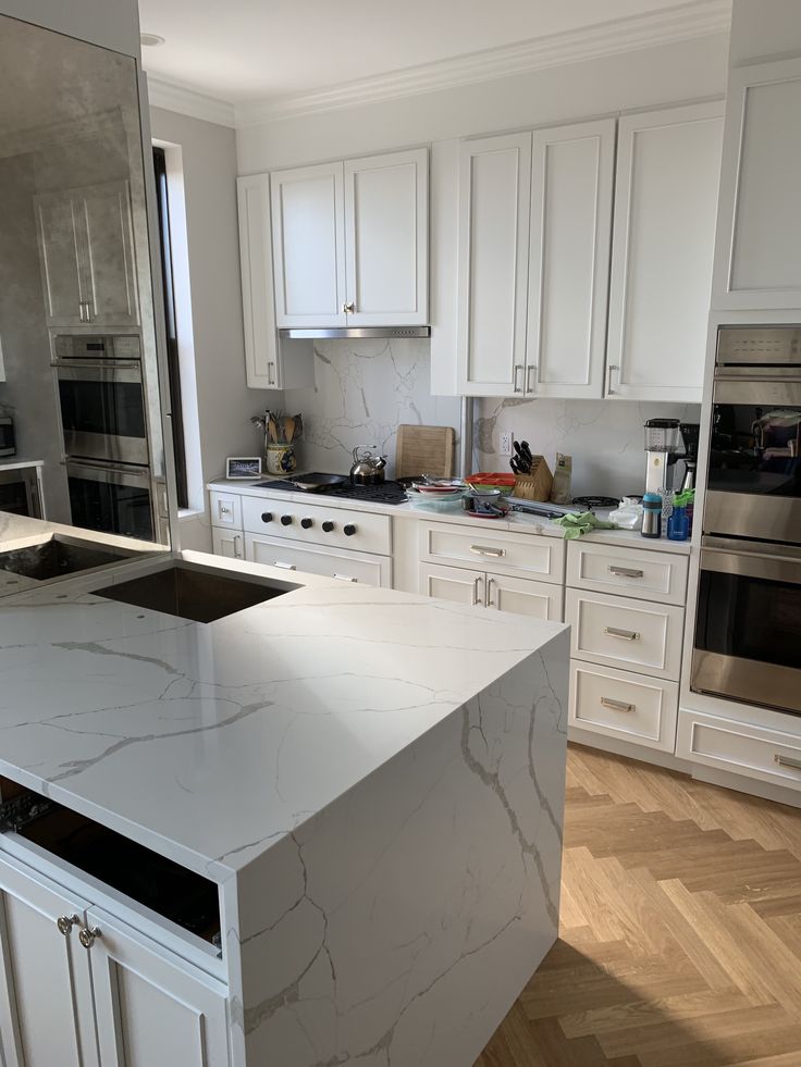 Quartz Countertops with White Kitchen Cabinets