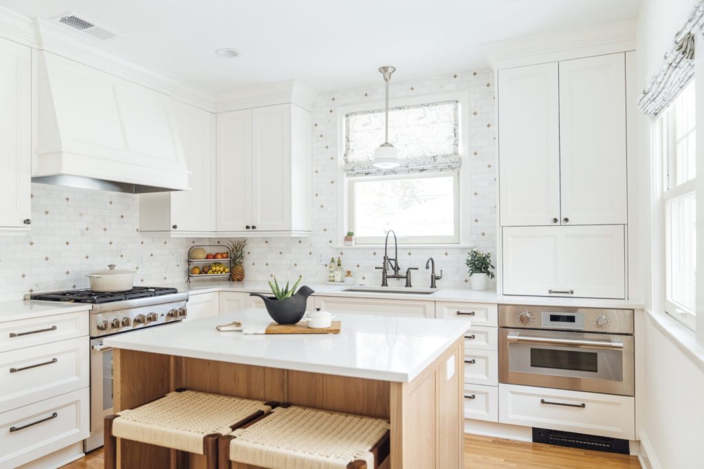 oak cabinets with white countertop