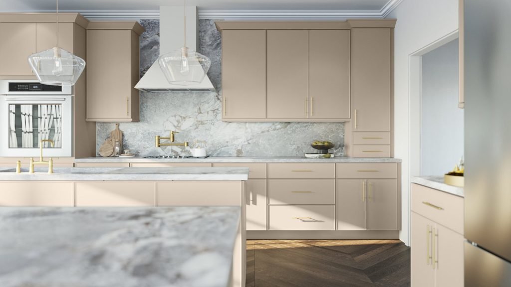 Oyster micro shaker kitchen cabinets with white marble counters and island, slim brass hardware and a light wood floor. Fabuwood Echo.
