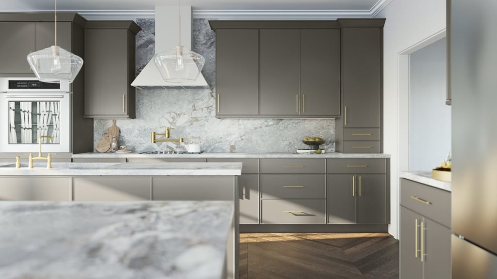 Stone micro shaker kitchen cabinets with white marble counters and island, slim brass hardware and a light wood floor. Fabuwood Echo.