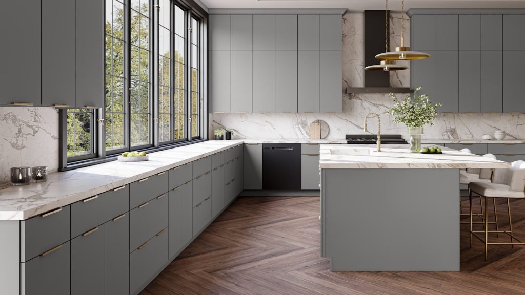 Nickel flat panel slab kitchen cabinets with white marble counters and island, black framed windows and long brass bar pulls. Fabuwood Luxe.