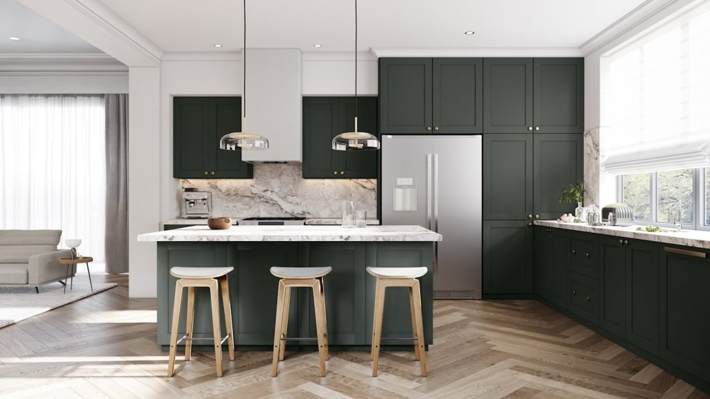 Verde Salvia frameless wide shaker kitchen cabinets with a white perimeter and island below contrasting tall cabinetry, a marble backsplash and a wood floor. Fabuwood Tuscany.